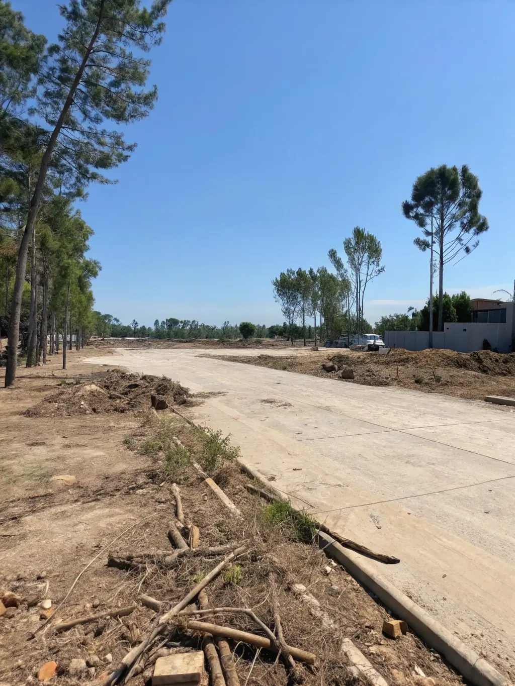 A photo of a completely cleared lot ready for construction, showing a level and debris-free site.